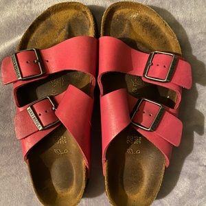 Pink Arizona Birkenstock’s size 38 wide.
